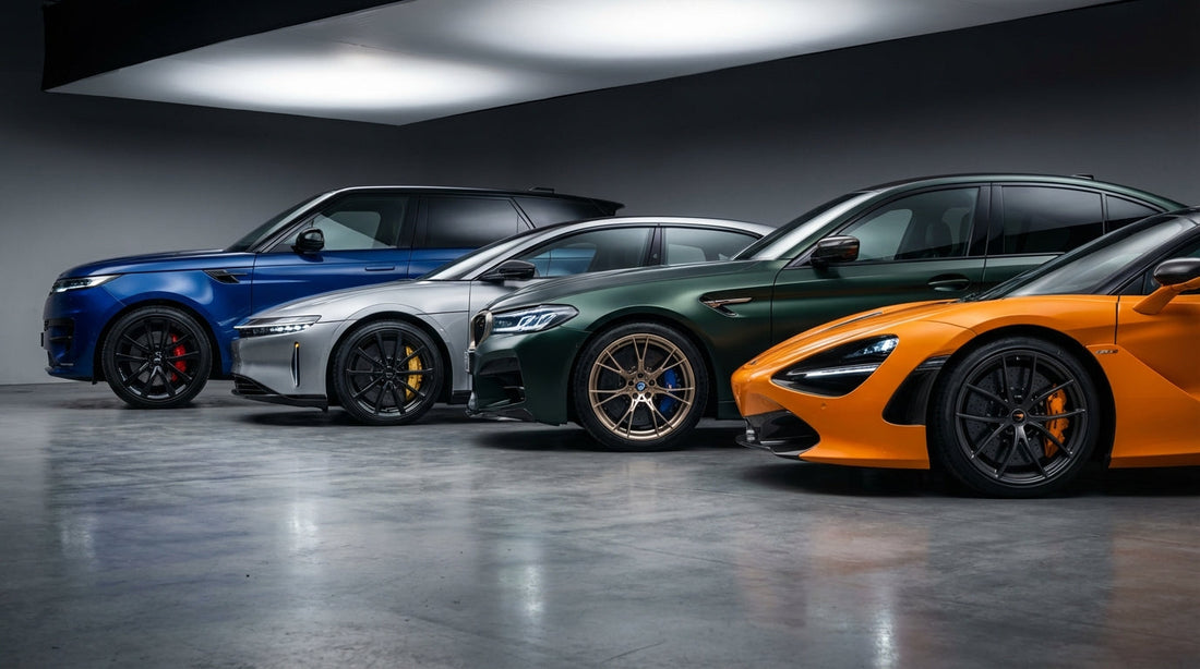 A professional lineup of different vehicle types showcasing high-performance carbon ceramic brake rotors and multi-piston calipers under dramatic studio lighting.
