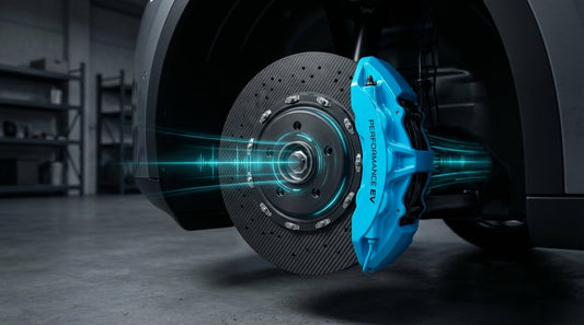 Close-up of a carbon ceramic brake rotor and high-performance caliper on an electric vehicle with blue light effects representing regenerative braking.