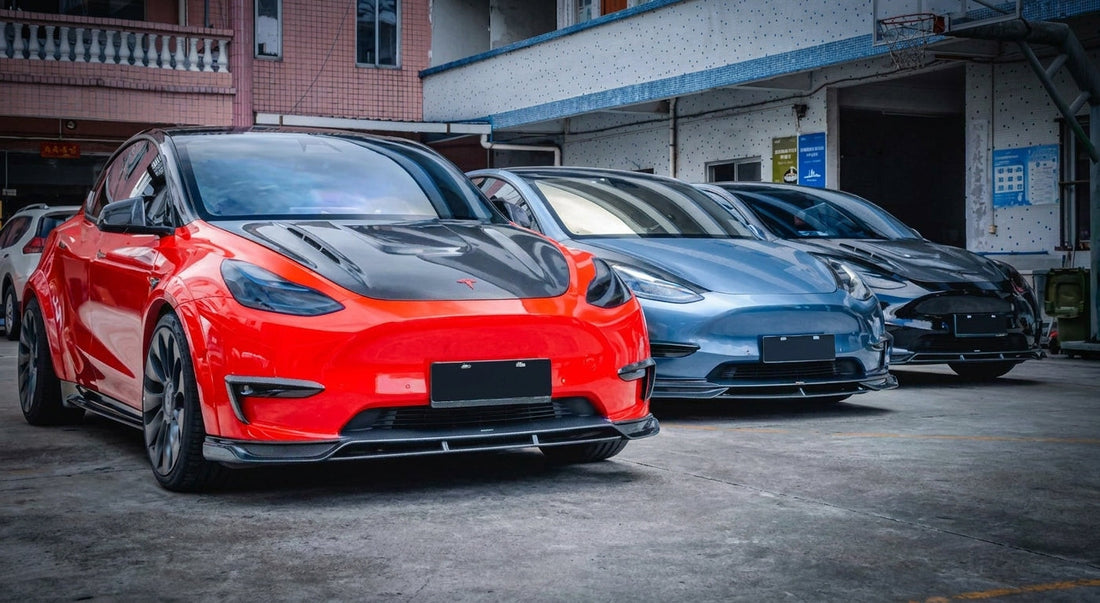 Tesla Model Y in gloss red wearing a CMST carbon fibre widebody body kit with raised rear wing and carbon diffuser