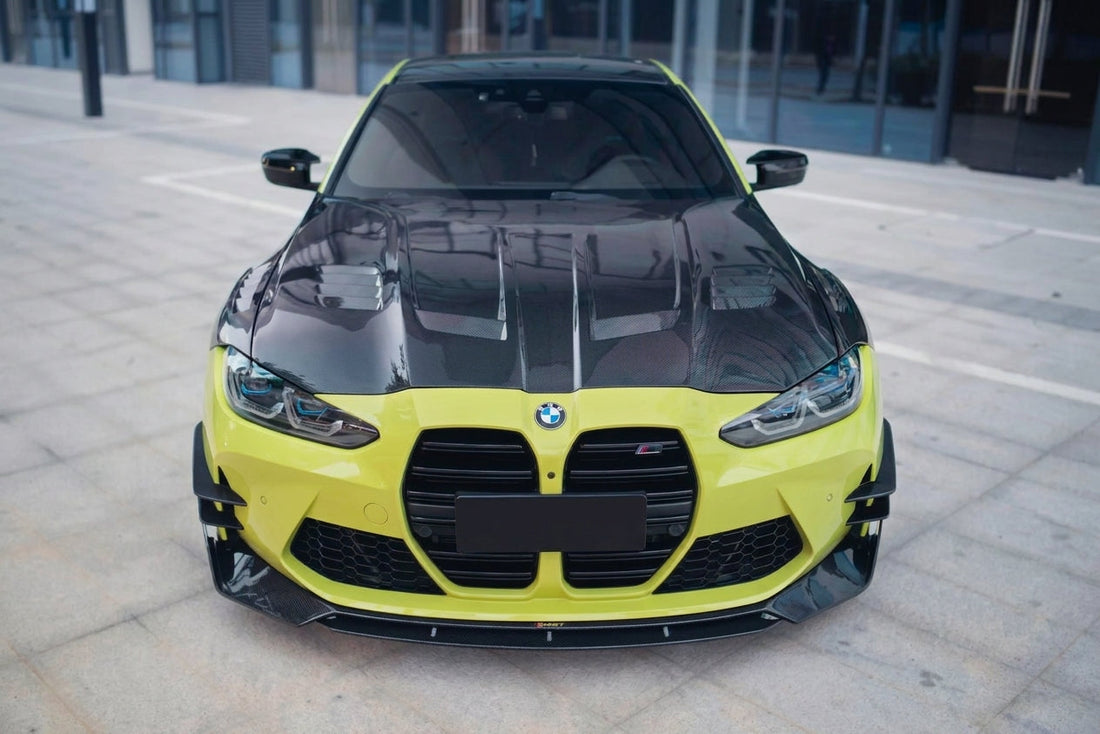 BMW M4 G82 in Sao Paulo Yellow with CMST carbon fibre bonnet and front lip, low front three-quarter hero