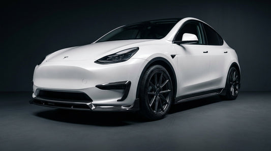Tesla Model Y with CMST carbon fibre front lip and side skirts, studio photography, 3/4 front low angle