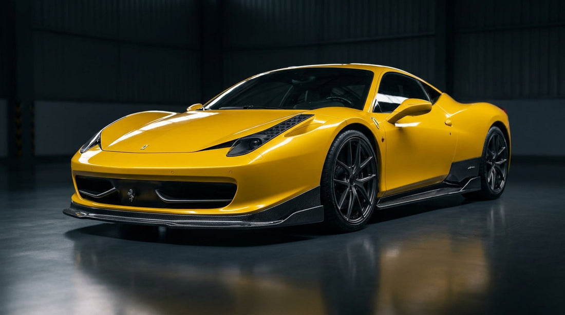 Yellow Ferrari 458 Italia with the CMST dry-carbon aero kit, front three-quarter low angle showing carbon front lip, splitter and side skirts