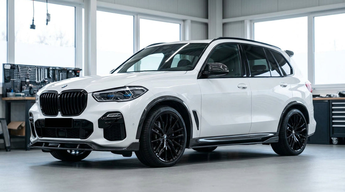 White BMW X5 G05 LCI with CMST carbon front lip, arches and roof spoiler, front three-quarter studio shot