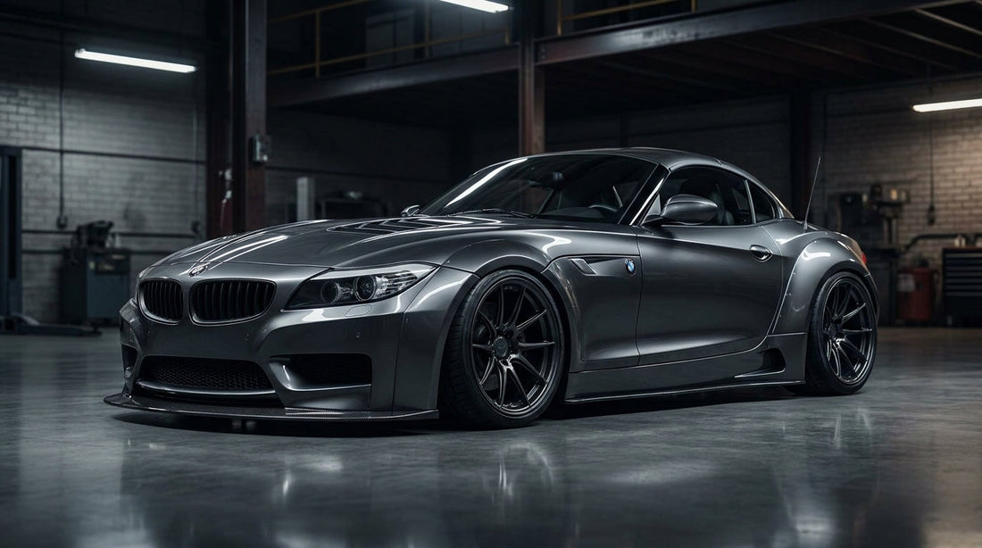 BMW Z4 E89 roadster with a wide-body kit and flared fenders, low front three-quarter hero in a moody garage