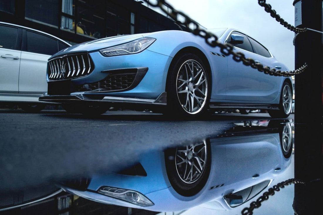 Light blue Maserati Ghibli with CMST carbon-fibre kit and forged wheels, low front three-quarter hero