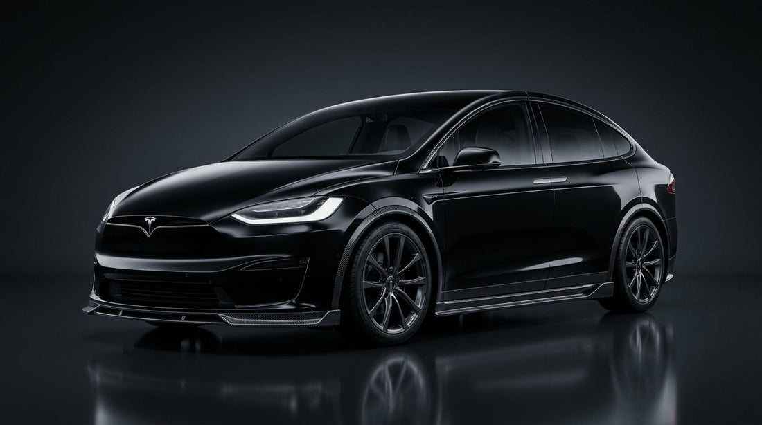 2023 Tesla Model X in black with a CMST carbon fibre front lip, side skirts and rear diffuser, 3/4 front low angle in a studio