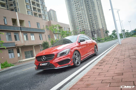 Red Mercedes-Benz CLA wearing a CMST carbon fibre small kit with front lip and canards, front three-quarter low angle in a studio