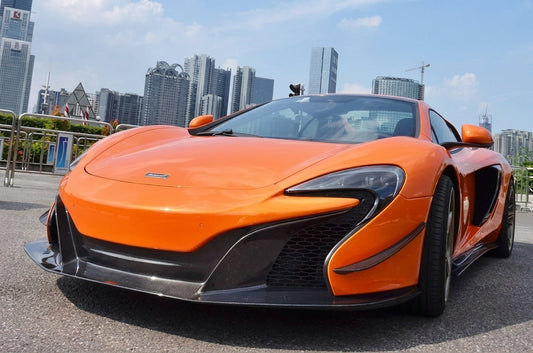 Orange McLaren 650S with full CMST carbon-fibre aero kit and bronze forged wheels, low front three-quarter hero