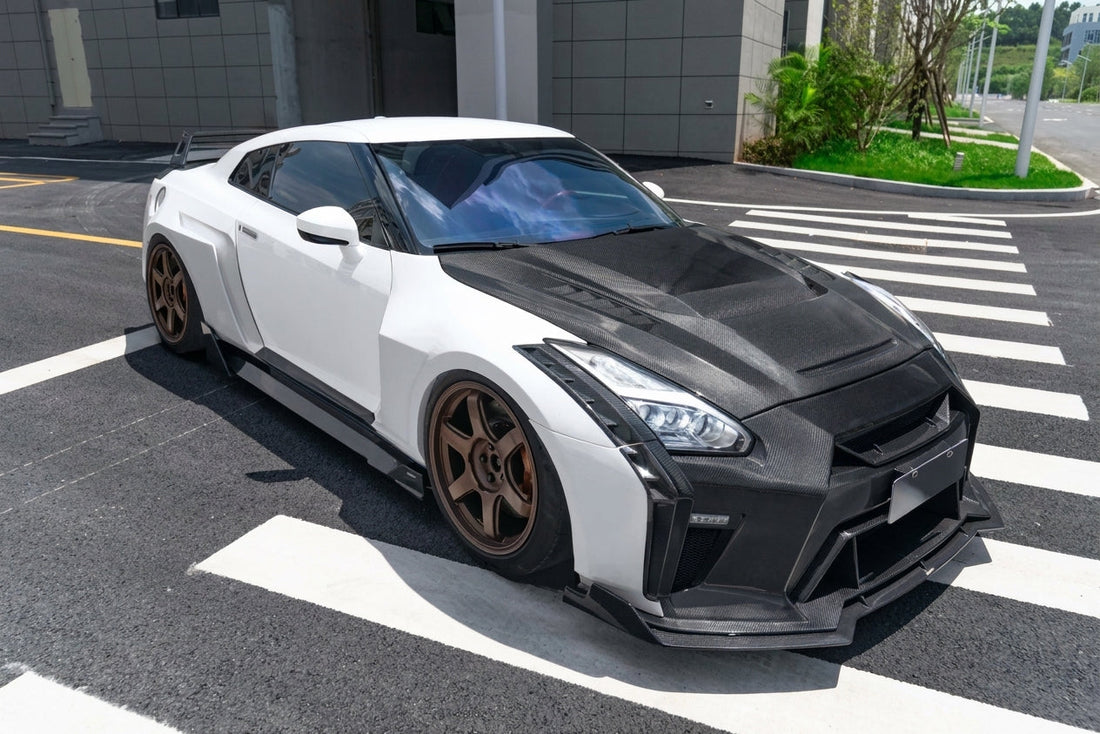 Nissan GT-R R35 in white with CMST carbon-fibre widebody kit and bronze forged wheels, low front three-quarter hero