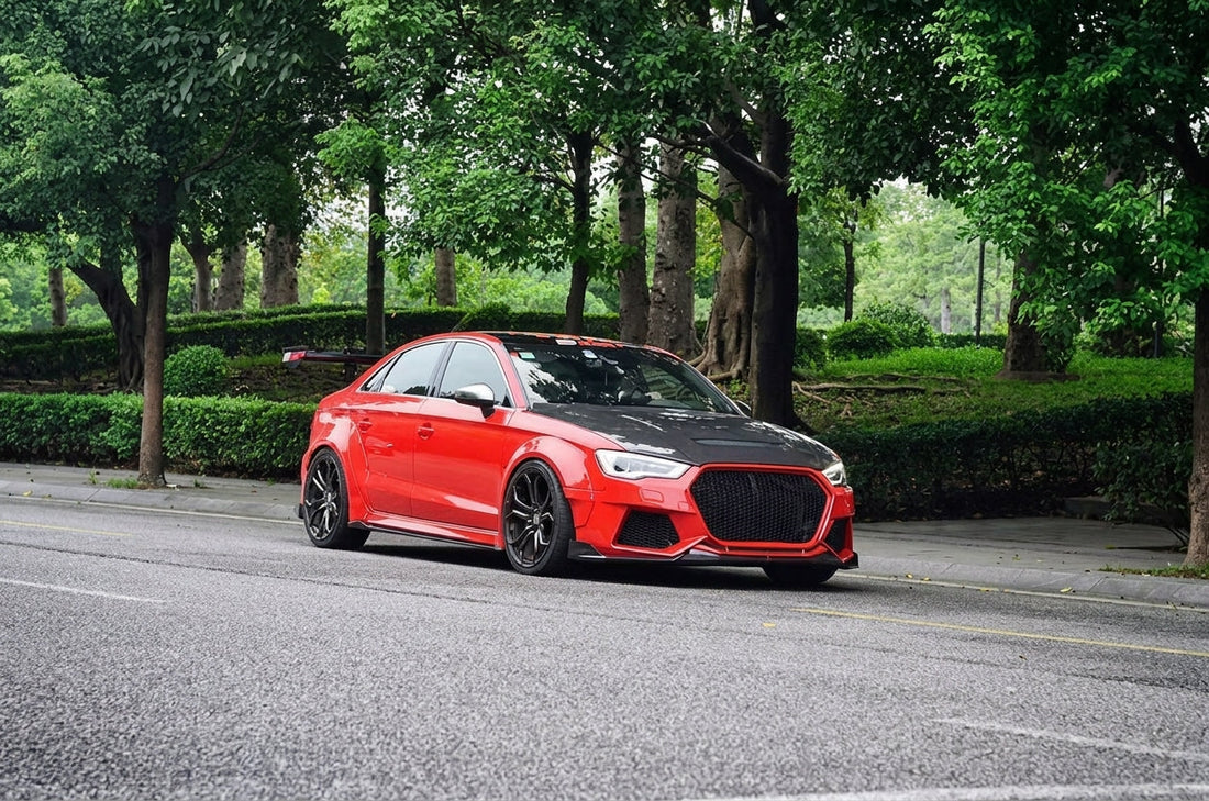 Red Audi S3 saloon with CMST widebody kit, carbon front lip and vented bonnet, three-quarter front low angle