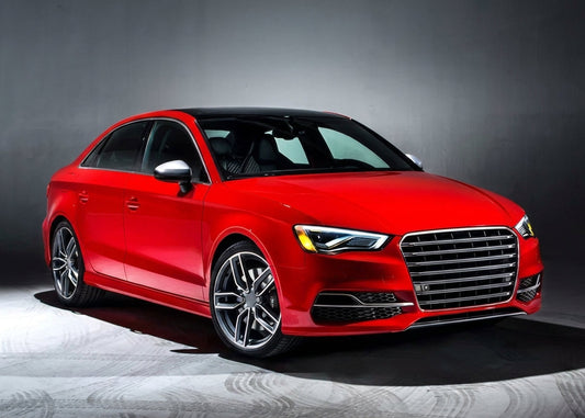 Red Audi S3 with CMST carbon fibre front lip, three-quarter front low angle in a moody studio