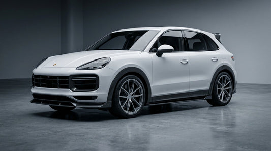 White Porsche Cayenne 9YA with CMST dry carbon-fibre front lip, wide wheel arches and rear wing in a studio