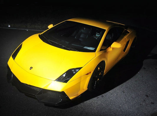 Yellow Lamborghini Gallardo LP560 with full CMST carbon exterior kit, front splitter, side skirts and rear under-spoiler, low front three-quarter hero