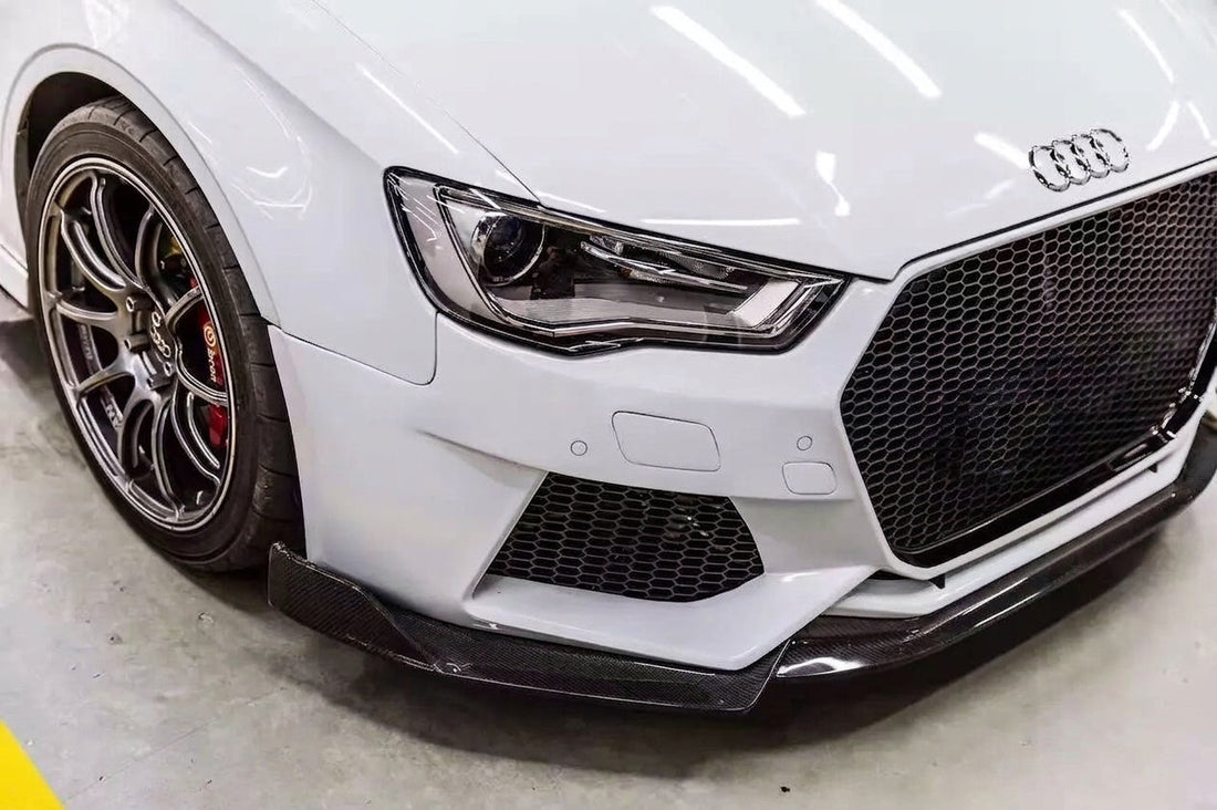 White Audi S3 with CMST big-mouth front bumper and carbon lip, three-quarter front low angle