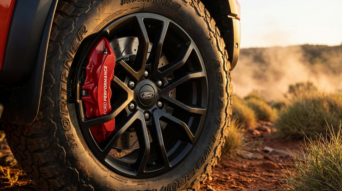 Close-up of a high-performance Ford Ranger big brake kit with red calipers and slotted rotors for heavy-duty Australian towing and off-road use.