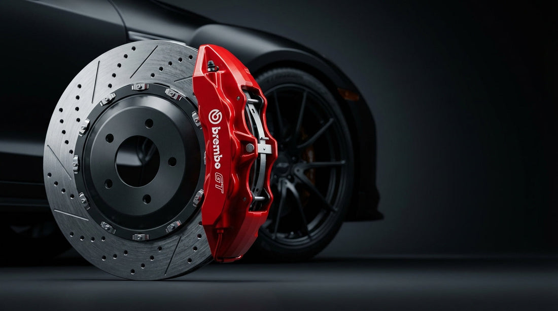 A high-performance big brake kit featuring a red multi-piston caliper and a cross-drilled slotted rotor in a professional studio setting.