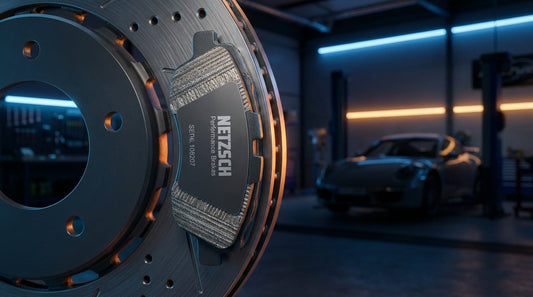 Close-up of a high-performance NETZSCH brake pad and ventilated rotor representing German precision braking technology.