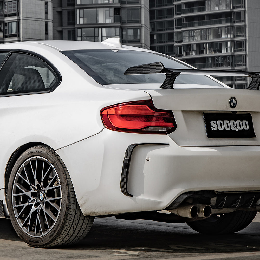 SOOQOO BMW M2 F87 carbon fibre rear vent trim - top-down view showing panel alignment