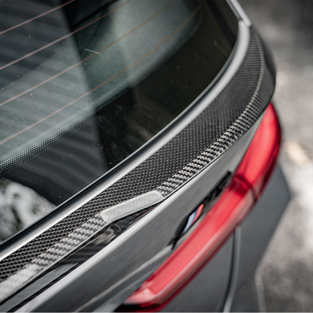 SOOQOO BMW M3 G81 carbon fibre spoiler - top-down view showing panel alignment