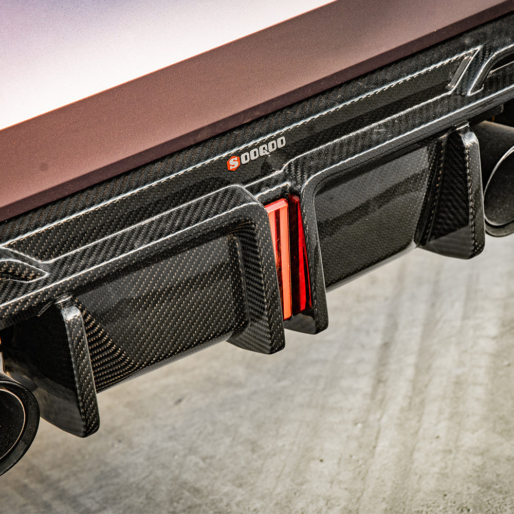 SOOQOO BMW M4 G82 carbon fibre rear diffuser - top-down view showing panel alignment